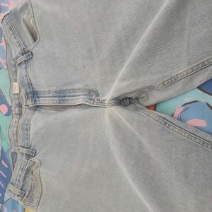 Pair of Levi's 560 tapered leg light indigo wash 42x32 jeans